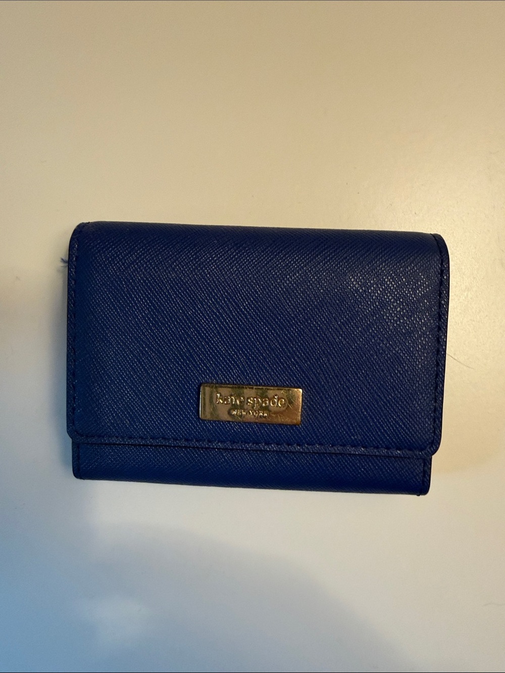 kate spade cobalt blue Saffiano leather compact wallet with gold plaque
